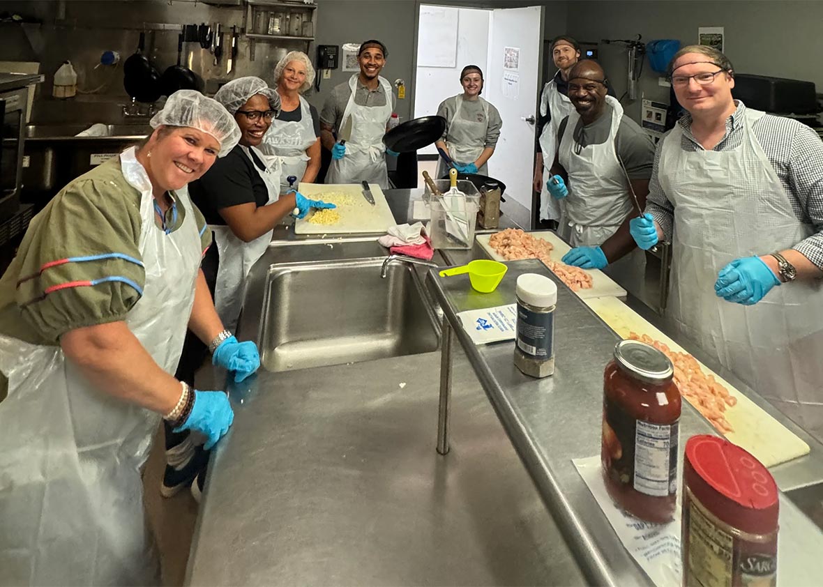 Dinsmore team prepares meals in a kitchen