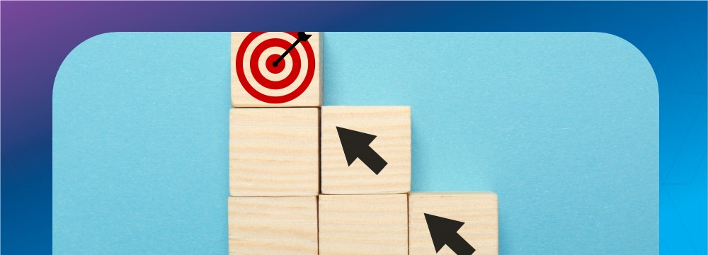 Wooden Blocks stacked with arrows pointing to a target