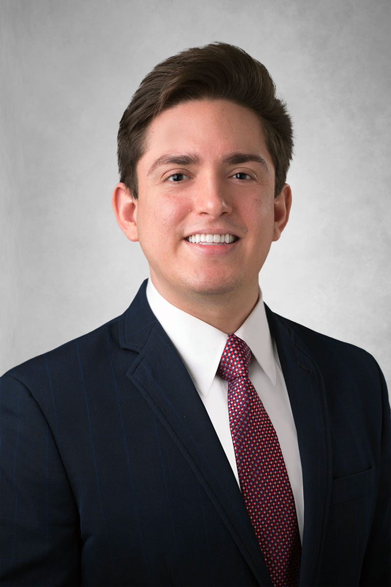 Ethan J. Thomas headshot.