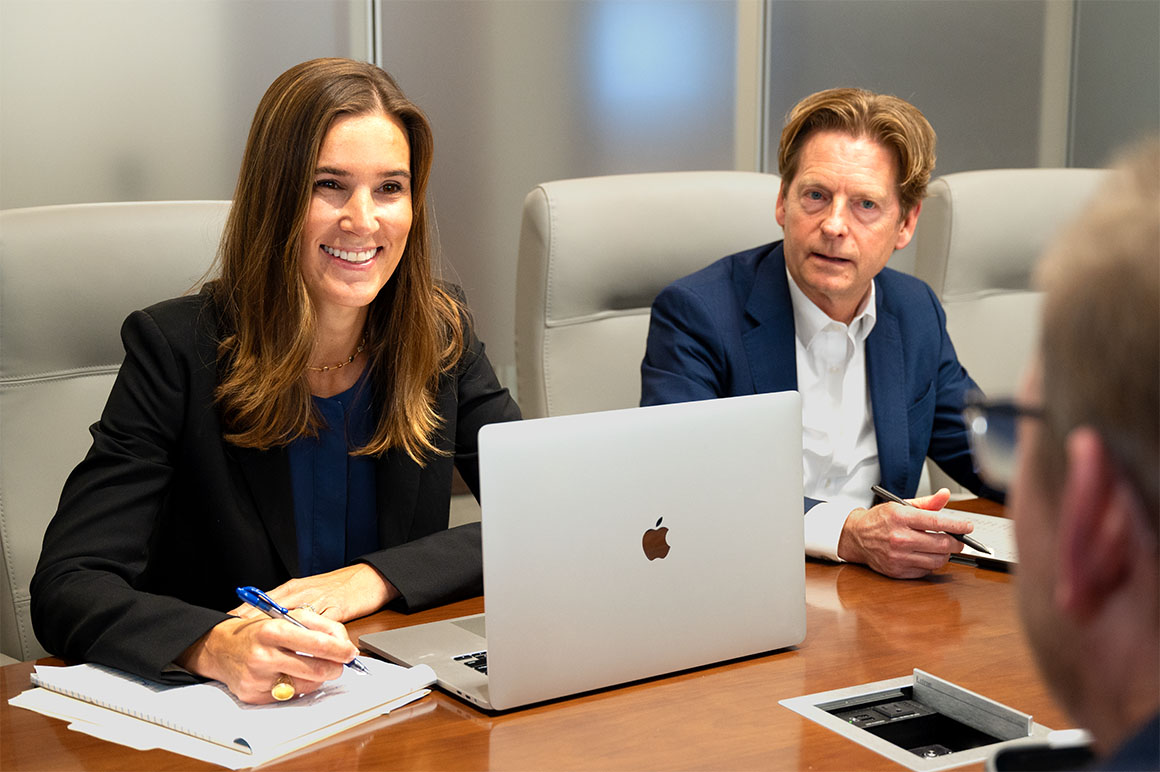 woman and man at desk